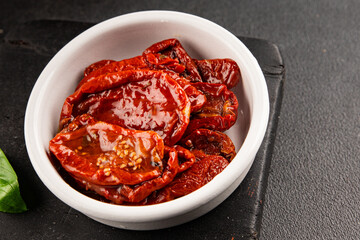 Sun-dried tomatoes snack vegetables natural product tasty snack fresh delicious gourmet food background on the table rustic top view copy space keto and paleo diet vegan and vegan food