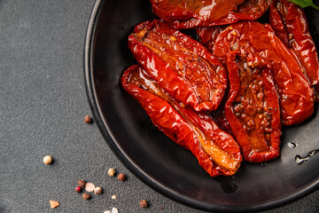 Sun-dried tomatoes snack vegetables natural product tasty snack fresh delicious gourmet food background on the table rustic top view copy space keto and paleo diet vegan and vegan food