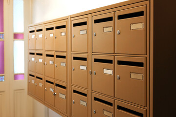 Many metal mailboxes with keyholes at post office