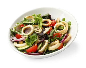 Delicious salad with squid rings and vegetables in bowl isolated on white