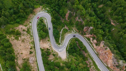 a winding road - a serpentine in the mountains leading to the Dzhily-su tract, where cars drive
