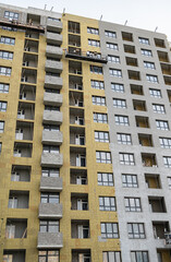 Fototapeta premium Construction of multi-apartment residential buildings. Construction of a house.