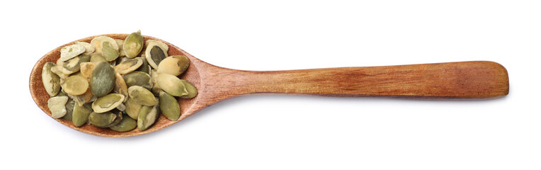 Pumpkin seeds in spoon isolated on white, top view