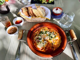 Traditional Moroccan Breakfast with Bread, Eggs, and Tea