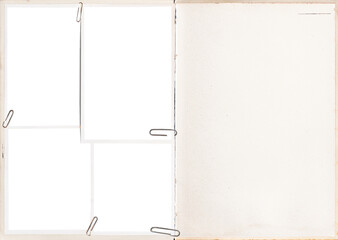 A vintage book pages with blank photo frames attached with paper clips.