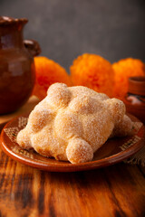Pan de Muerto. Typical Mexican sweet bread that is consumed in the season of the day of the dead. It is a main element in the altars and offerings in the festivity of the day of the dead.