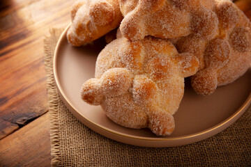 Pan de Muerto. Typical Mexican sweet bread that is consumed in the season of the day of the dead. It is a main element in the altars and offerings in the festivity of the day of the dead.