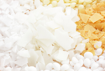 Variety of emulsifiers  with cosmetic ingredients and mix of wax , macro, closeup