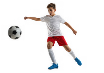 Young soccer player kicking a ball isolated on transparent background in studio