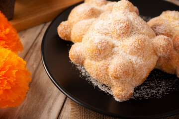 Pan de Muerto. Typical Mexican sweet bread that is consumed in the season of the day of the dead. It is a main element in the altars and offerings in the festivity of the day of the dead.