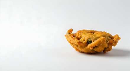 A minimalist shot of a single piece of pakora
