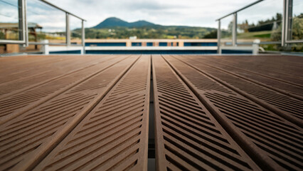 Textured anti-slip decking with grooves overlooking mountains and lake  