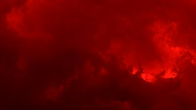 Red cloud texture background. Blurred photo of red sky with clouds. Photo can be used for galaxy space, New Year, Christmas and all celebrations backgrounds.