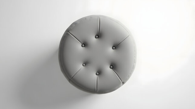 Stylish gray upholstered ottoman with tufted design, adding a modern touch to any space.