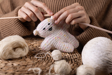 Knitting Hands Creating a Soft Crochet Bear – Cozy Handmade Moment of Love and Craft