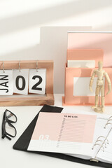 Desktop calendar on a modern desktop. Schedule and time planning in office and business.