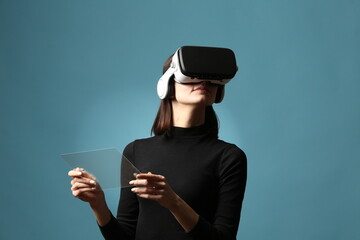 Woman Using Virtual Reality Headset and Touching Futuristic Transparent Dashboard Interface