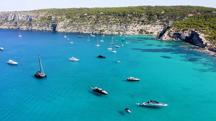 Obraz premium Aerial view of the anchorage for yachts, on the island of Formentera, Spain, and the area called En Caló.