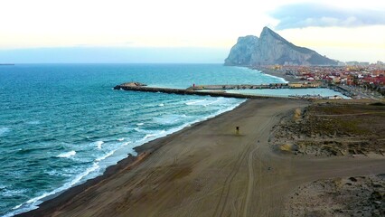Aerial view of the beautiful beaches of La Atunara in the province of Cádiz, Andalusia, Spain, and Gibraltar Rock,