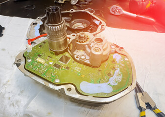 Electric bicycle motor repair. Open the engine during service at an e-bike service center. Ebike Hub Repair. E-bike engine Repairing. EBike Motor Performance Line. Small roughness sharpness, possible.
