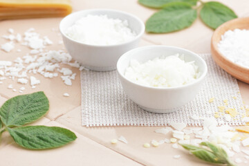 Emulsifier in a bowl  with cosmetic ingredients and mix of wax , macro, closeup