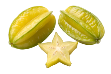 Two whole yellow star fruits and one slice against black background carambola tropical fruit