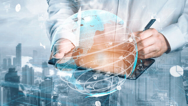 A professional presents a digital tablet featuring a globe interface, illustrating the fusion of technology and global connectivity in an urban business environment. Xenic