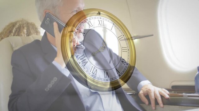 Businessman retrieving smartphone and calling in airline seat with clock overlay advancing - Powered by Adobe