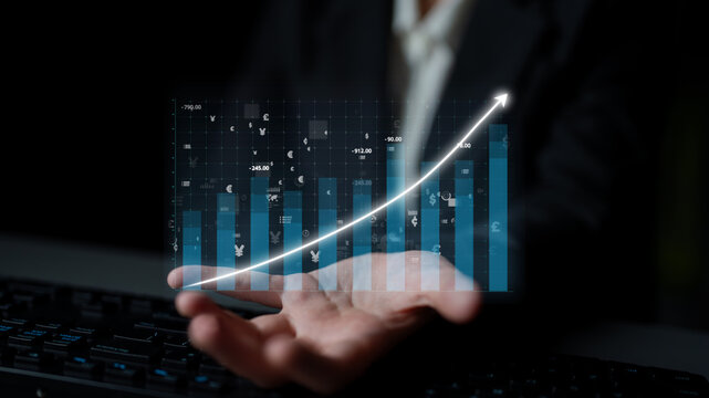 A businessman displays a digital growth chart with numeric symbols, symbolizing financial success and strategic planning in a modern office environment. Impute