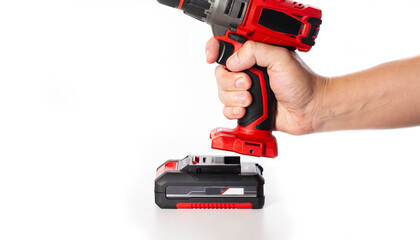 Replacing the battery in a new drill screwdriver on a white background, battery charge and...