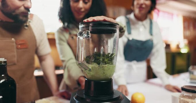 Hands, chef and people with blender, kitchen and teamwork for meal prep, advice and culinary skills. Helping, interns and mentor with tips for cooking, group and mixing ingredients which machine - Powered by Adobe