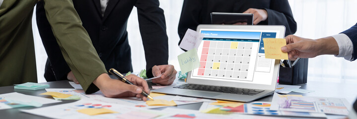 Analyst team use sticky note for creative and analytic brainstorm for business idea with BI data dashboard on laptop screen. Analysis financial data visualization tech for marketing strategy. Prodigy