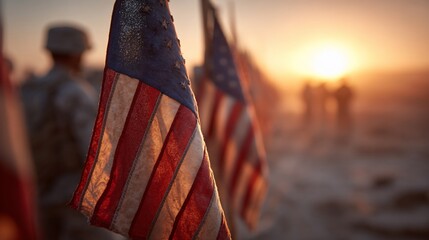 Naklejka premium US flags at sunset with soldiers in soft focus, symbolizing remembrance