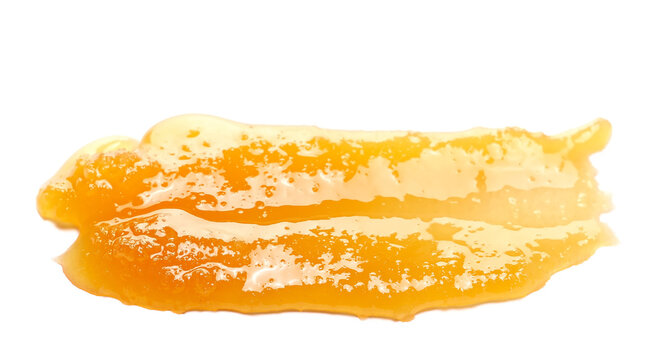 Natural crystallized honey spill isolated on white, side view