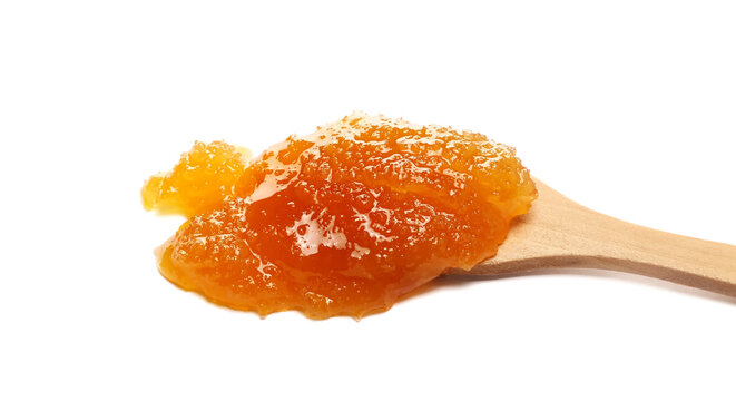 Natural crystallized honey spill in wooden spoon isolated on white, side view