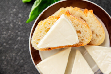 Processed cheese triangle spread portion size cheese for sandwich tasty snack fresh delicious gourmet food background on the table rustic food top view copy space