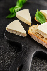 Processed cheese triangle spread portion size cheese for sandwich tasty snack fresh delicious gourmet food background on the table rustic food top view copy space