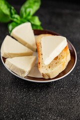 Processed cheese triangle spread portion size cheese for sandwich tasty snack fresh delicious gourmet food background on the table rustic food top view copy space
