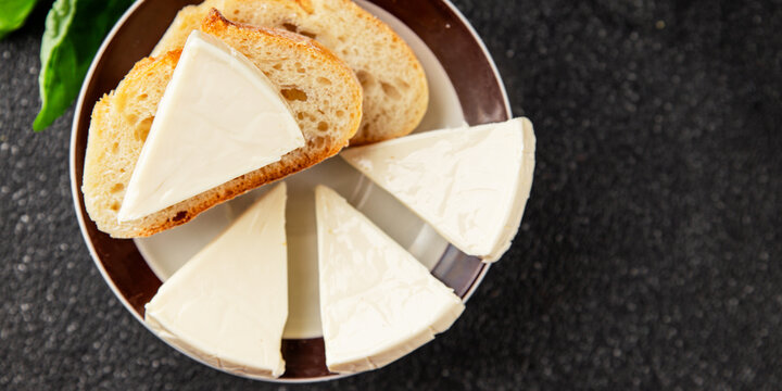 Processed cheese triangle spread portion size cheese for sandwich tasty snack fresh delicious gourmet food background on the table rustic food top view copy space
