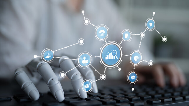 A robotic hand interacts with digital icons and graphs, showcasing the intersection of technology and business in a modern office environment that emphasizes innovation. Tessel
