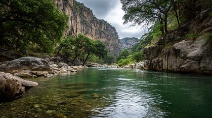 Experience the tranquility of a stunning river flowing through majestic cliffs and lush greenery, perfect for travel blogs, nature documentaries, and outdoor adventure promotions