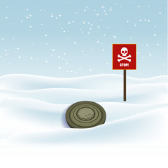 The mine is camouflaged in the grass and snow