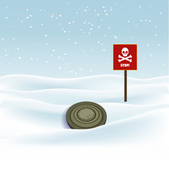 The mine is camouflaged in the grass and snow