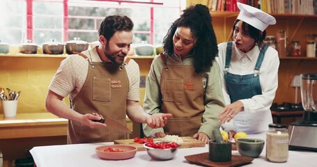 Cutting, vegetables and cooking in kitchen, team or happy for culinary skills, learning and cuisine. Chop, ingredients and mentor with advice for meal prep, people and collaboration in restaurant