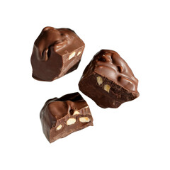 Obraz premium Three pieces of rich milk chocolate fudge with chopped nuts, isolated on transparent background