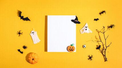 A Hint of Haunt and a Pop of Fun: A Minimalist Halloween Banner on a Spooky Yet Playful Yellow Backdrop