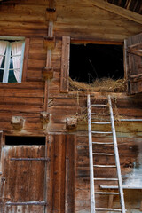 Hayloft in a traditional wooden barn in the upper Lauterbrunnen valley at Trachsellauenen, Bernese Oberland, Switzerland