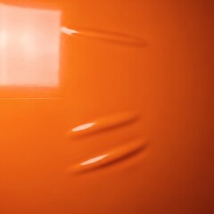 Glossy orange latex fabric background with smooth, reflective surface and vibrant highlights. The material glows under light, creating a bold, energetic, and futuristic aesthetic. Ideal for fashion