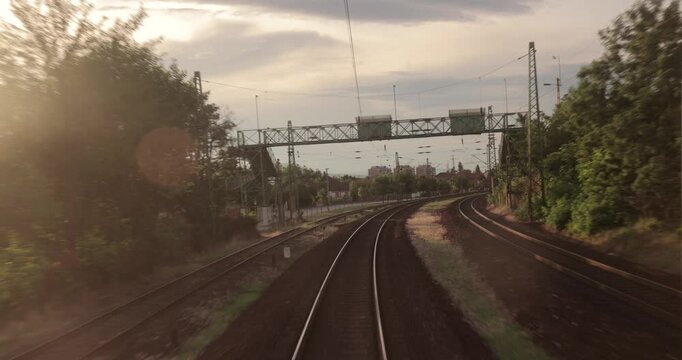 Railway travel rear view in sunset