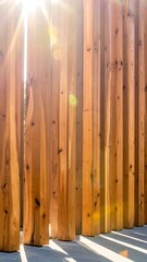 Obraz premium Vertical wooden slats with sunlight streaming through